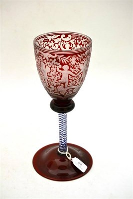 Lot 68 - A Bohemian Ruby Flashed Goblet, mid 19th century, the ovoid bowl engraved with a Bacchic putti...