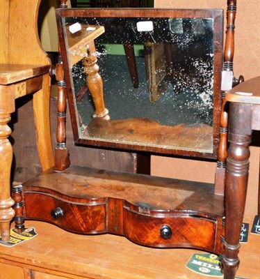 Lot 463 - A Regency mahogany serpentine shaped dressing table mirror