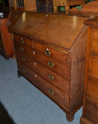 Lot 467 - An 18th century and later oak bureau