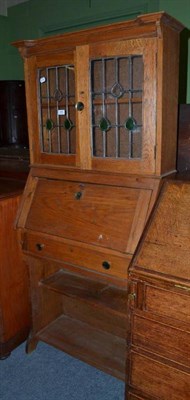 Lot 468 - An Arts & Crafts oak bureau bookcase