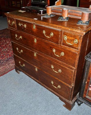 Lot 477 - A George III oak four height chest of drawers