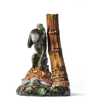 Lot 79 - A Royal Worcester Majolica Spill Vase, circa 1880, as a monkey sitting on a tortoise with a frog on