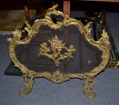 Lot 483 - A brass Rococo style firescreen