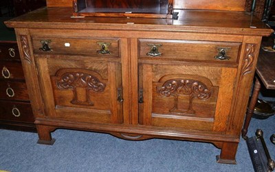 Lot 486 - Arts & Crafts carved oak sideboard