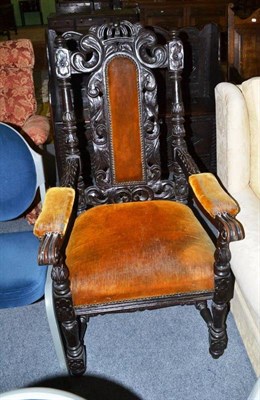 Lot 504 - Carved oak elbow chair