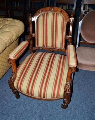 Lot 505 - An upholstered oak-framed Victorian easy chair