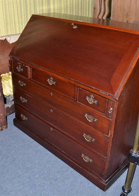 Lot 529 - A mahogany bureau with an arrangement of six drawers below a fall front