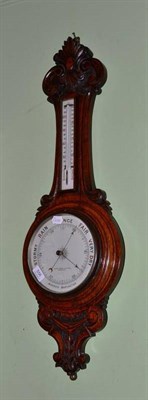 Lot 556 - Carved oak wheel barometer, retailed by Lloyd, Payne and Amiel