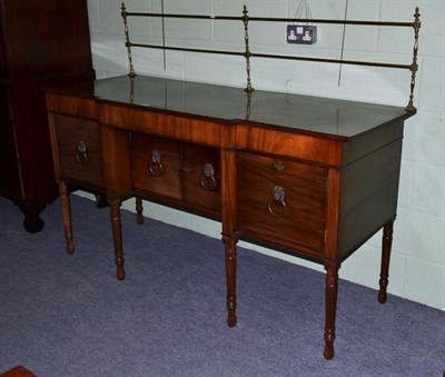 Lot 558 - A Regency mahogany breakfront sideboard, 2nd quarter 19th century, with elegant brass spindle...