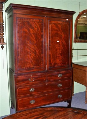 Lot 560 - A mahogany linen press