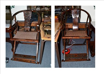 Lot 562 - A pair of Chinese horseshoe folding chairs