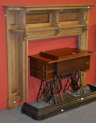 Lot 573 - An oak fire surround, a Singer sewing machine and a cast iron fire curb