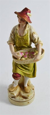 Lot 7 - A Royal Dux figure of a fruit vendor