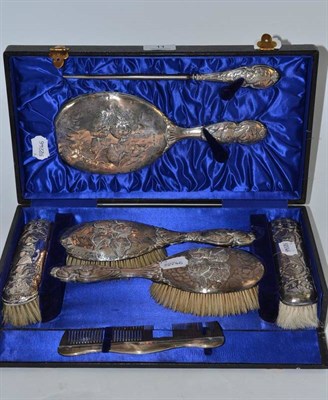 Lot 11 - Cased silver backed dressing table set