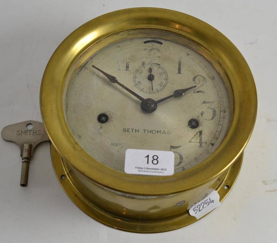 Lot 18 A ship's brass clock by Seth Thomas