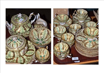Lot 21 - A 19th century porcelain tea service, with green and gilt floral decoration on a yellow ground,...