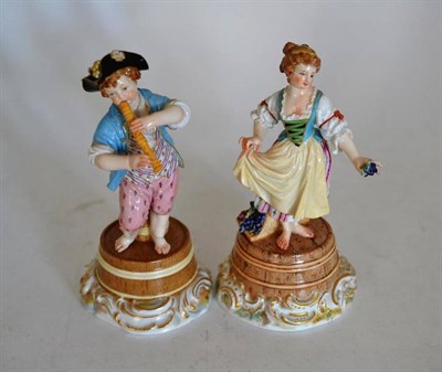 Lot 101 - A Pair of Meissen Porcelain Figures of Vine Harvesters, late 19th century, he playing a pipe,...