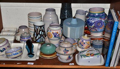 Lot 79 - A quantity of Poole pottery and related magazines and a book entitled ";Poole Pottery"; on a shelf