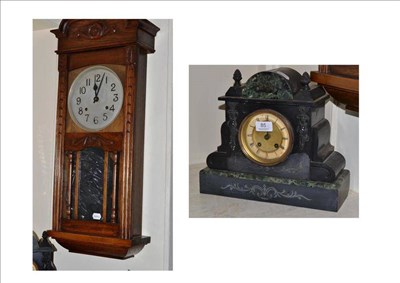 Lot 85 - A striking wall clock in an oak case and a slate mantel clock (2)