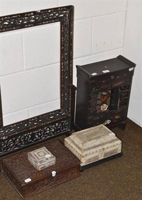 Lot 87 - A Japanese lacquer table cabinet, a padouk wood table screen and stand, an Indian carved wood...