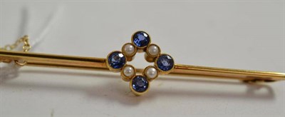 Lot 98 - A sapphire and pearl set brooch stamped '15ct'