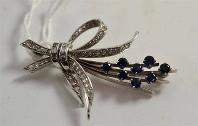 Lot 103 - A diamond and sapphire sprig brooch