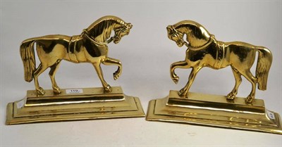 Lot 119 - Two brass horse hearth ornaments