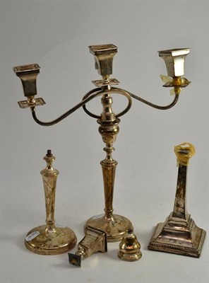 Lot 128 - A loaded silver candelabra (damaged) and a pair of loaded silver candlesticks (damaged)