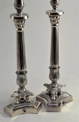 Lot 134 - Pair of silver plated table lamps on tri-form bases