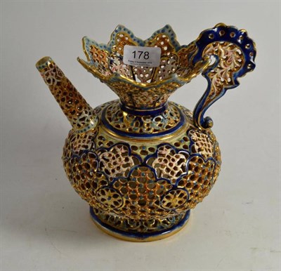 Lot 178 - A pierced puzzle jug, stamped underside 'Fisher Budapest'