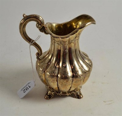 Lot 192 - A Victorian silver milk jug, London 1846, with presentation iscription to the base and case feet