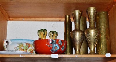 Lot 202 - Five brass shell cases, Royal Albert plates, chamber pot, Clarice Cliff bowl, a coaching horn, etc