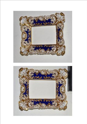 Lot 209 - A pair of 19th century English porcelain foliate moulded picture frames decorated in blue and gilt