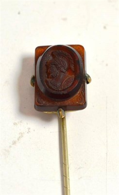 Lot 226 - A gilt metal stick pin mounted with a carved cameo mount of a Grecian warrior