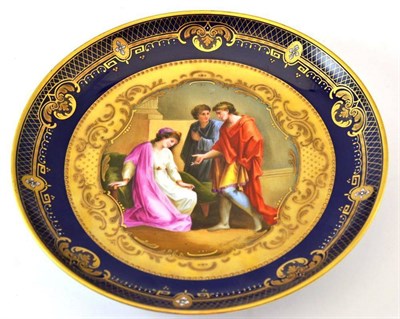 Lot 118 - A "Vienna " Porcelain Saucer Dish, circa 1900, painted with Augustus and Cleopatra within a...
