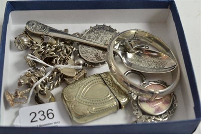 Lot 236 - A silver bangle, a silver spoon of Durham Cathedral, a charm bracelet, two lockets and a brooch