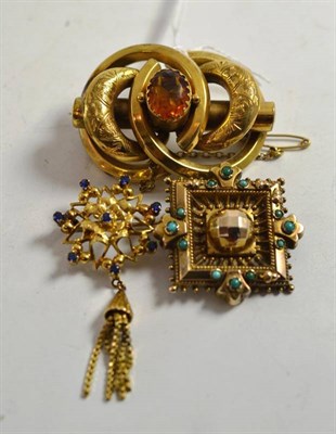 Lot 240 - A pinchback brooch, a turquoise set brooch with applied acorn detail and a brooch with fringe...