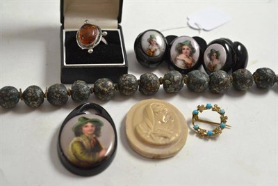 Lot 242 - A jet bracelet (a.f.) with matching pendant, an amber ring, a hardstone earring, a brooch and a...