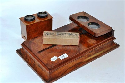 Lot 254 - A burr walnut stereoscopic viewer (a.f.); a walnut small box stereoscopic viewer and a box of...