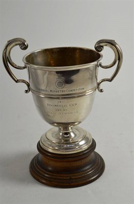 Lot 280 - A silver two handled pedestal trophy cup ";Annual Musketry Competition";, London 1910,  with...