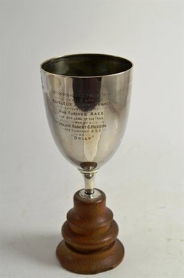 Lot 281 - A silver pedestal trophy cup, Sheffield 1912, on a fixed oak socle