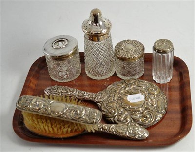 Lot 285 - A silver topped glass hair tidy and two toilet jars, a silver topped glass sugar caster, a...