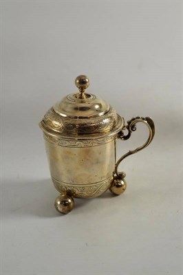 Lot 299 - A Victorian silver mustard pot raised on three ball feet, Lodnon 1860