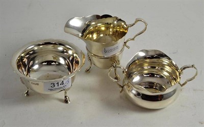 Lot 314 - A cream jug, twin handled sauce boat and a silver dish