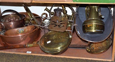 Lot 336 - A shelf of brass and copper including a settling pan, coal skuttle, warming pan, jug, two pairs...