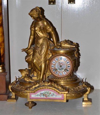 Lot 340 - A late 19th century French gilt metal porcelain mantel clock