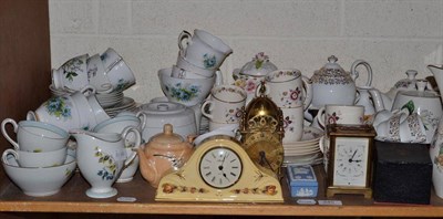 Lot 345 - Shelf of decorative ceramics and ornaments including carriage clock, lantern clock and...