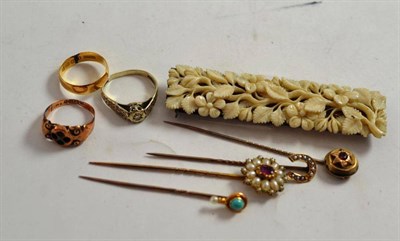 Lot 349 - Four stick pins set with seed pearls, turquoise, ruby and garnet; three gold rings and a...