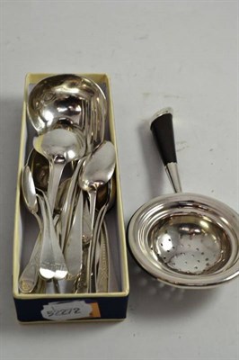 Lot 354 - A collection of mainly Georgian silver flatware, comprising a tea strainer, a sauce ladle,...