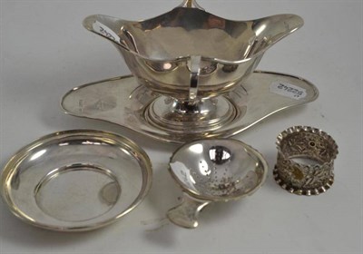 Lot 395 - Silver twin handled sauce boat and stand, silver napkin ring, silver bowl with plated tea...